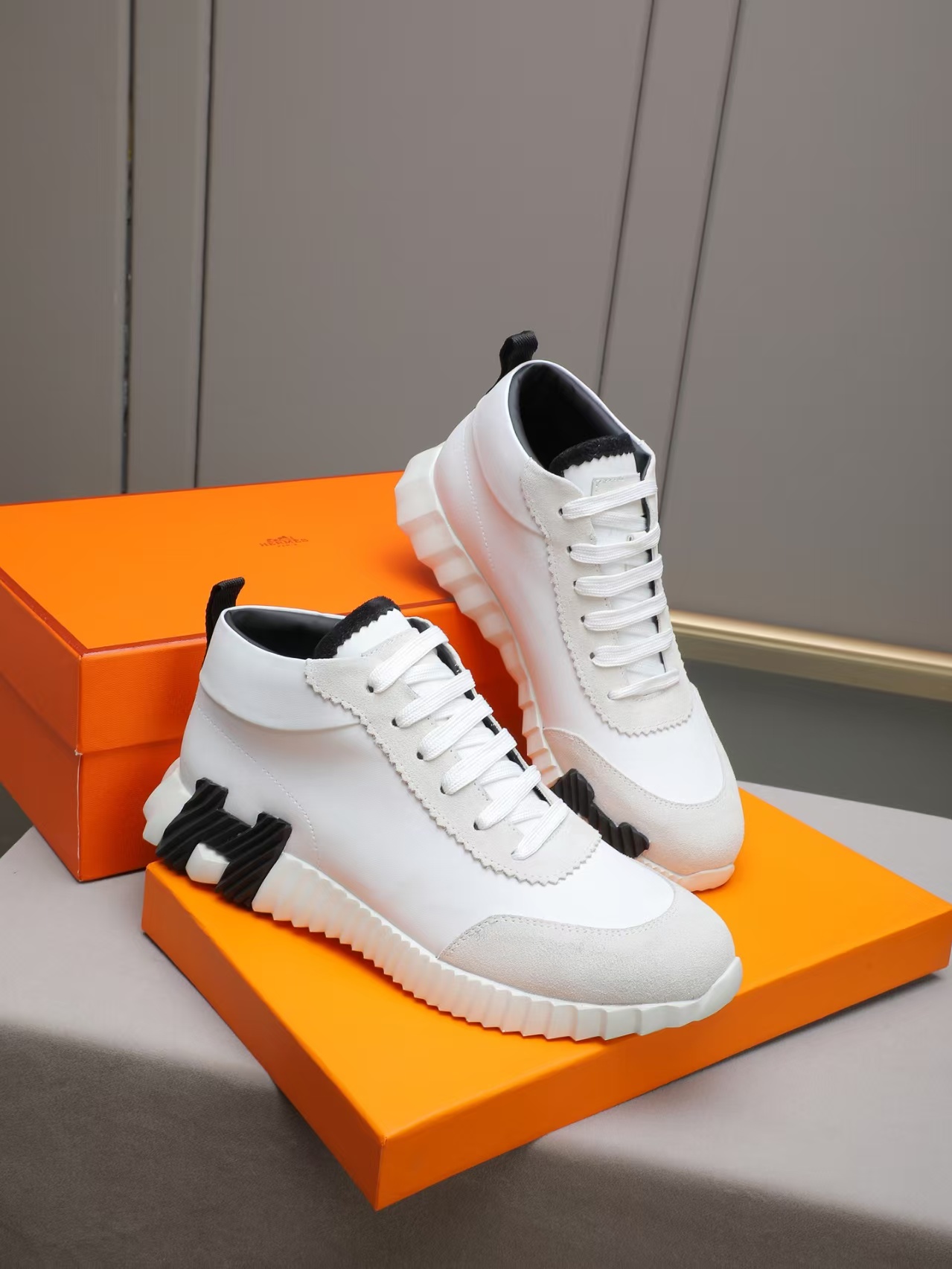 White luxury high shoes on orange box